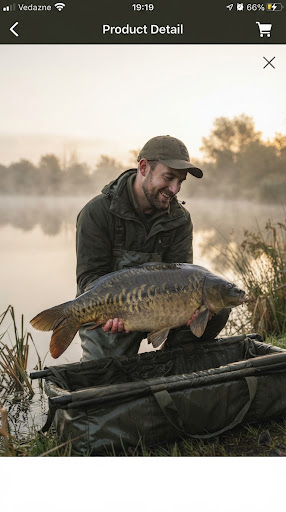 Happy angler holding a large mirror carp in warm morning mist by a tranquil lake, soft natural morning dawn glow, holding fish carefully in sling.