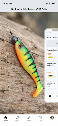 Savage Gear Cannibal Shad soft plastic bait 12cm Firetiger pattern on natural wood surface, predatory lure fishing setup