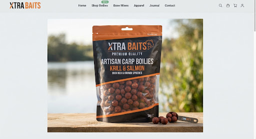 Crisp studio product presentation of sealed artisan carp boilies bag with rich red and brown bait spheres, labeled XTRA Baits premium quality.