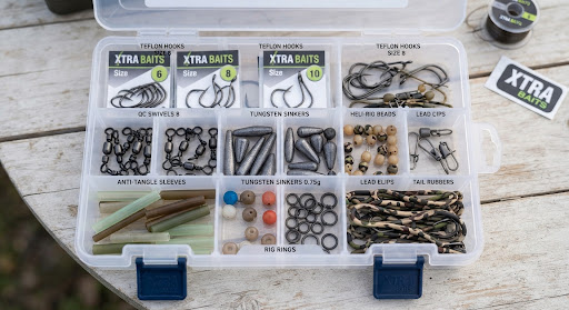 Carp fishing terminal tackle, Teflon coated hooks, swivels and tungsten sinkers meticulously placed in compartments of a tackle organizer tray